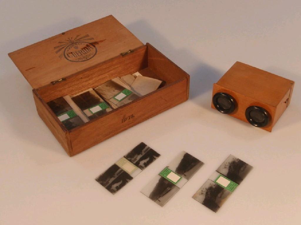 Appraisal: A vintage boxwood hand held stereoscopic viewer and a collection