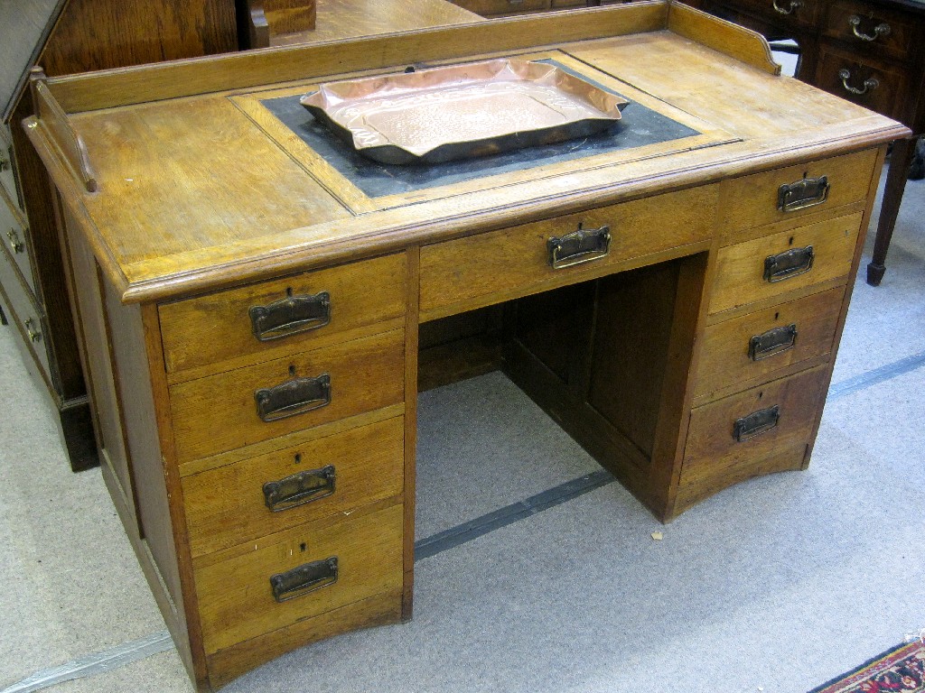 Appraisal: Arts and Crafts knee hole writing desk with integral writing