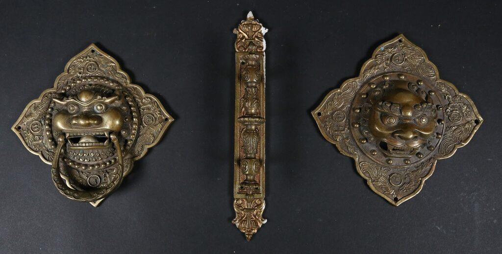 Appraisal: Chinese foo lion brass door knockers decorated with phoenix and