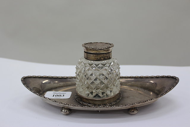 Appraisal: A SILVER BOAT SHAPED INK STAND with cut glass inkwell