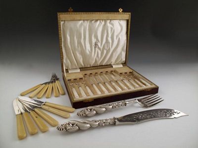 Appraisal: A set of six silver fruit knives and forks by