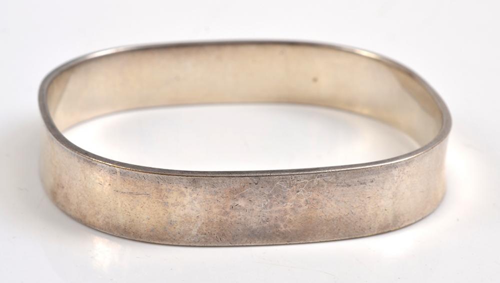 Appraisal: A BANGLE BY TIFFANY AND CO IN STERLING SILVER A