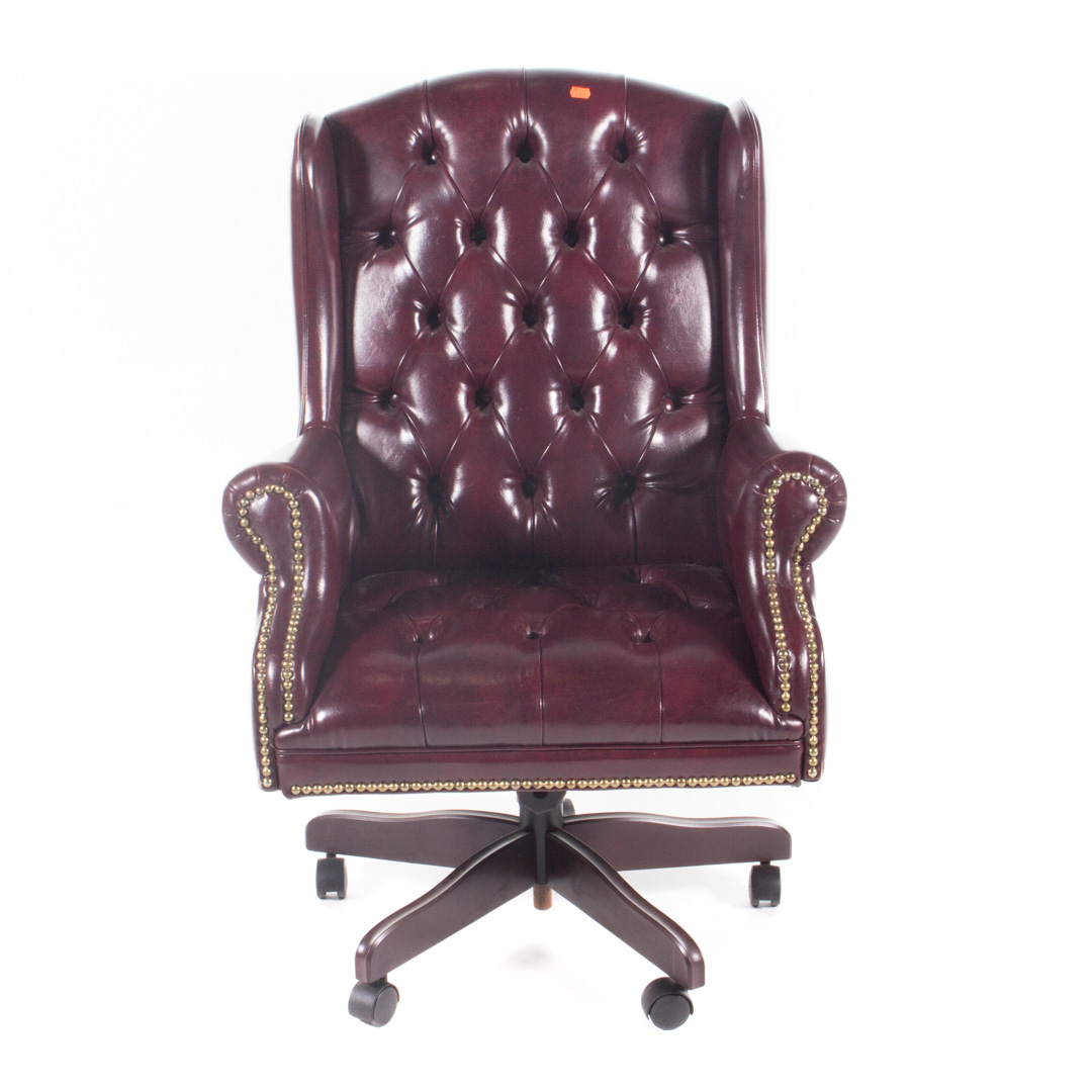 Appraisal: Leather upholstered wood executive swivel chair tack and button upholstery