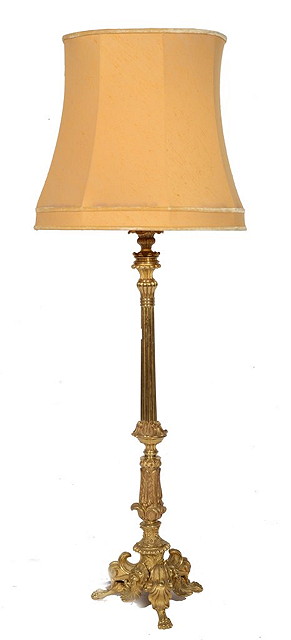 Appraisal: A BRASS ITALIANATE TALL TABLE LAMP the tripod base with