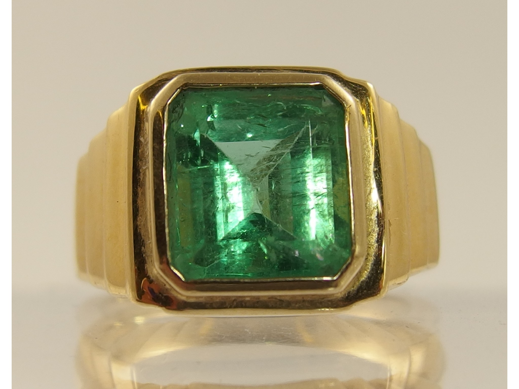 Appraisal: An ct emerald set gents dress ringthe step cut emerald