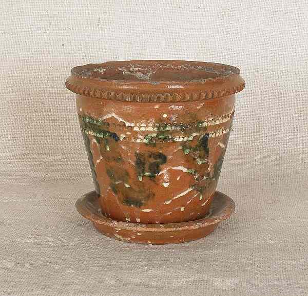 Appraisal: Pennsylvania redware flower pot with attached undertray th c with