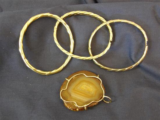 Appraisal: Three ct gold hinged bangles and an agate pendant grams