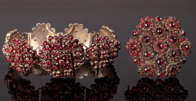 Appraisal: A Victorian circular garnet brooch of cluster form and a