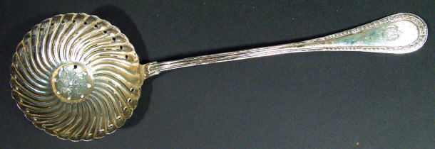 Appraisal: Continental silver sifting spoon with fluted bowl and chased handle