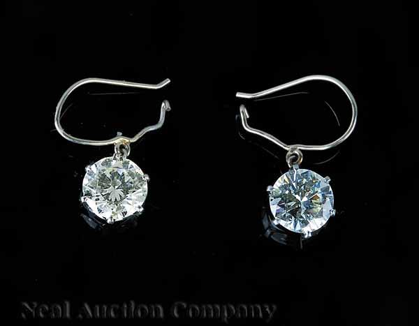 Appraisal: A Pair of Platinum and Diamond Earrings set with round