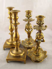 Appraisal: An unusual pair of brass rococo candlesticks each with the