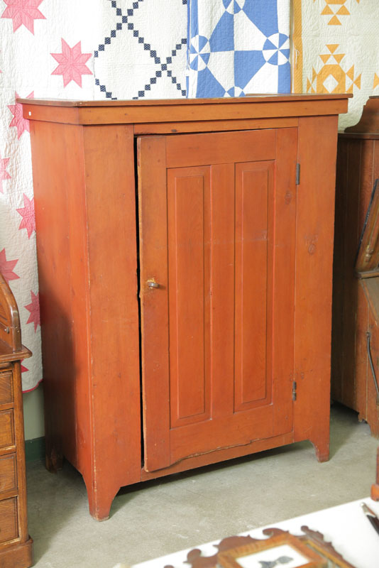 Appraisal: JELLY CUPBOARD Red stained cupboard having a paneled door four