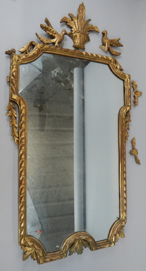 Appraisal: A giltwood and gesso rectangular wall mirror applied with flowers