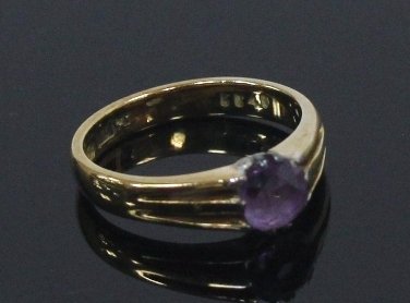 Appraisal: An amethyst solitaire ring the stone claw set the pierced