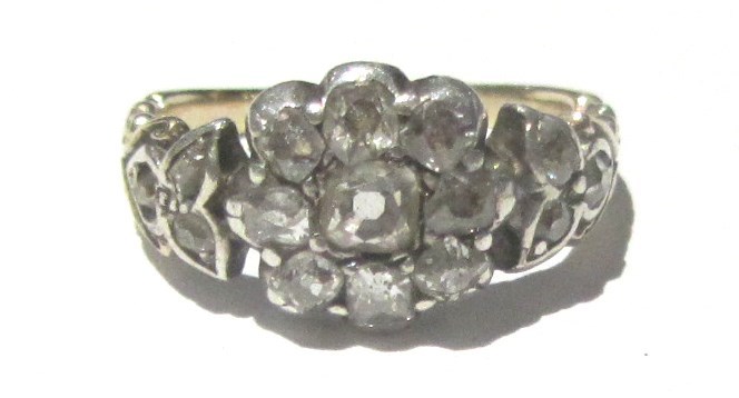 Appraisal: A diamond set nine stone cluster ring mounted with cushion