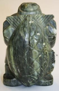 Appraisal: Inuit soapstone carving of a hunter w a large fish