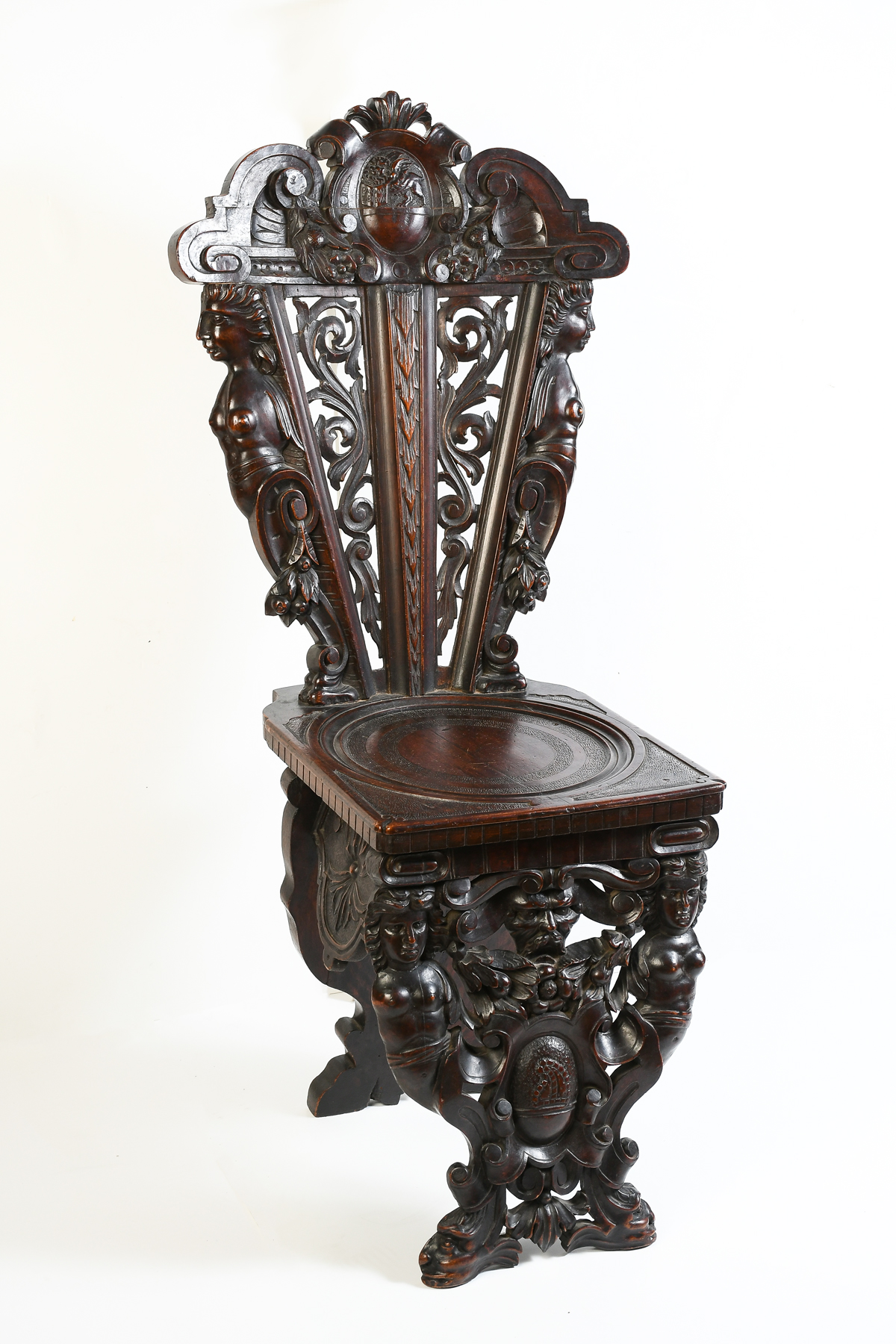 Appraisal: VICTORIAN CARVED FIGURAL CHAIR Pierced scrolling backrest with a Gryphon