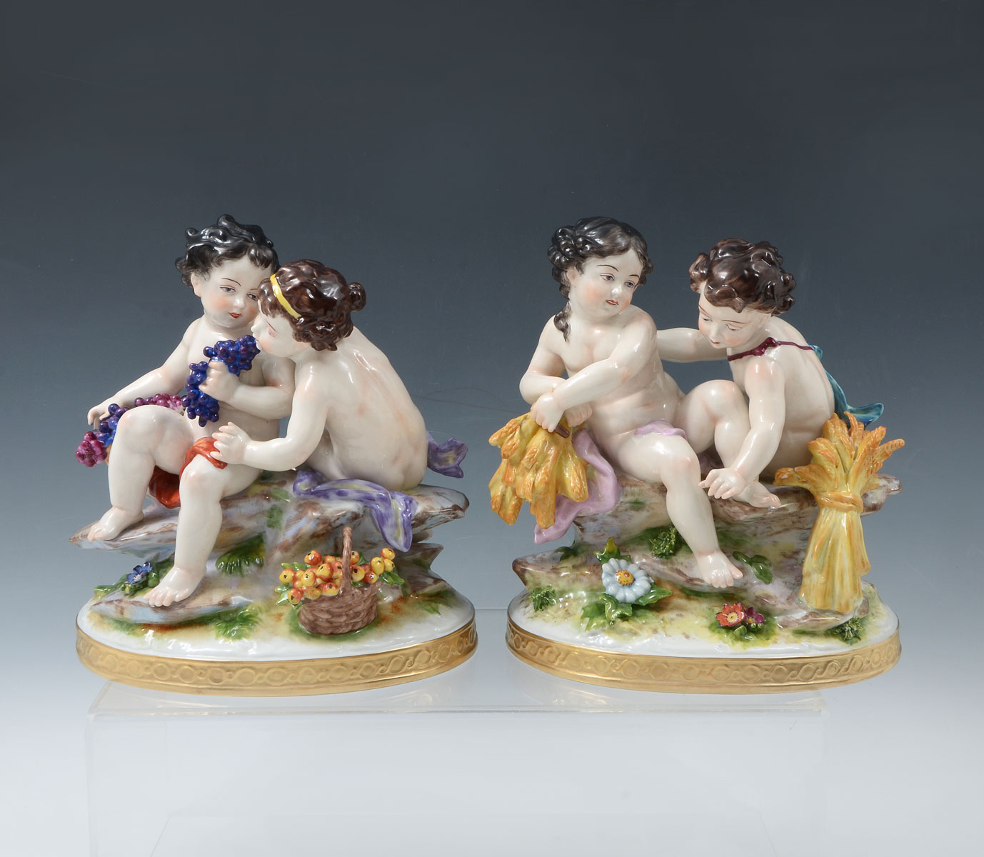 Appraisal: CAPODIMONTE PUTTI PORCELAIN GROUPINGS double cherub figures with harvested wheat