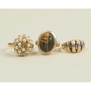 Appraisal: Three Gold Rings Three gold rings Tiger's eye ring marked