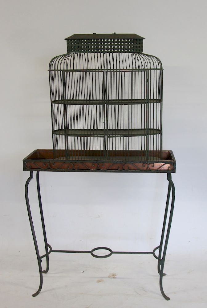 Appraisal: Antique Iron Planter Together With A Bird Cage Cabinet x