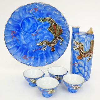 Appraisal: Six Piece Vintage Japanese Blue Dragonware Sake Set Includes bottle