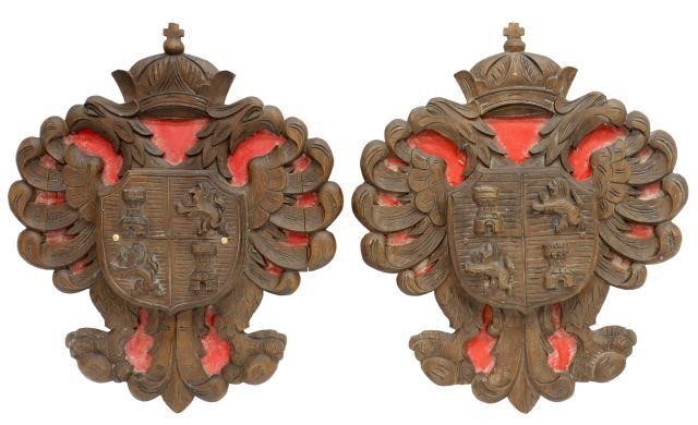 Appraisal: lot of Spanish carved walnut wall-mounted plaques coat of arms