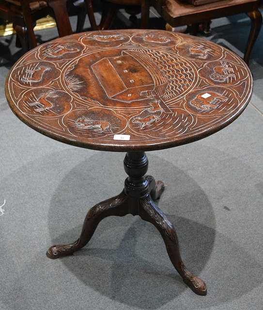 Appraisal: A Georgian mahogany tripod tablewith vase-shaped splat on swept supports