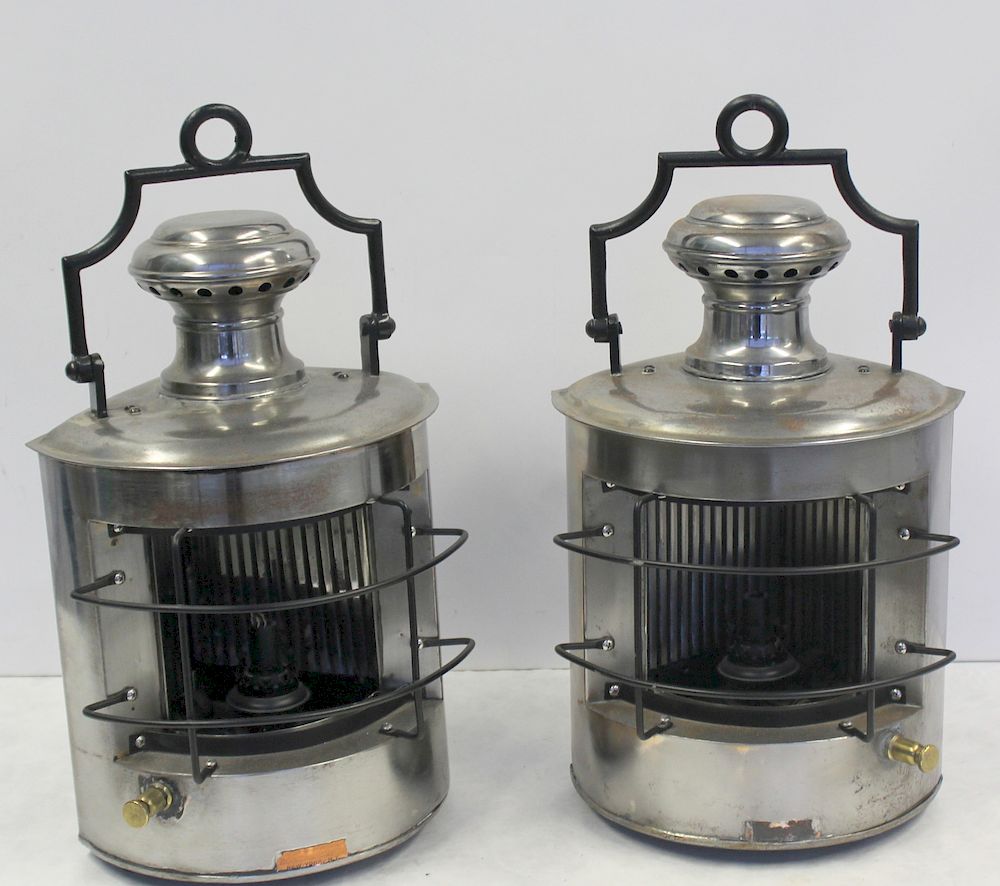 Appraisal: A Pair Of Polished Metal Ship's Lanterns No glass From