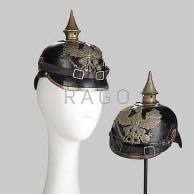 Appraisal: GERMAN PICKELHAUBE Two in leather one with brass mountings the