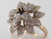 Appraisal: A carat gold clear stone ring of loose mounted floral