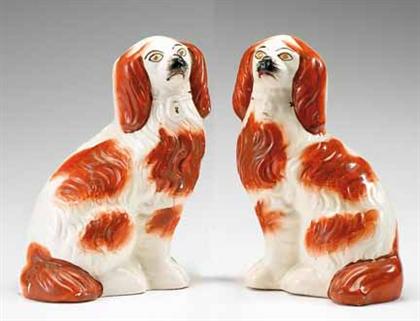 Appraisal: Pair of Staffordshire red and white spaniels th century Together