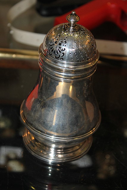 Appraisal: A SILVER CASTER of baluster form on pedestal foot with