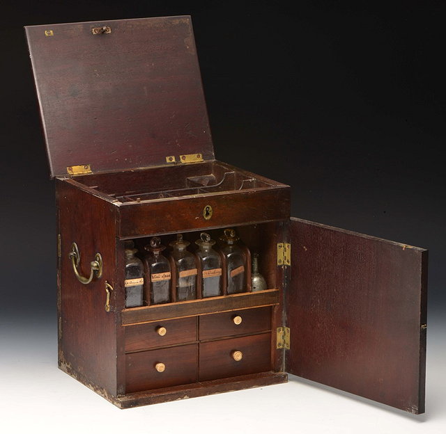 Appraisal: A GEORGE III MAHOGANY TRAVELLING MEDICINE BOX fitted apothecary jars