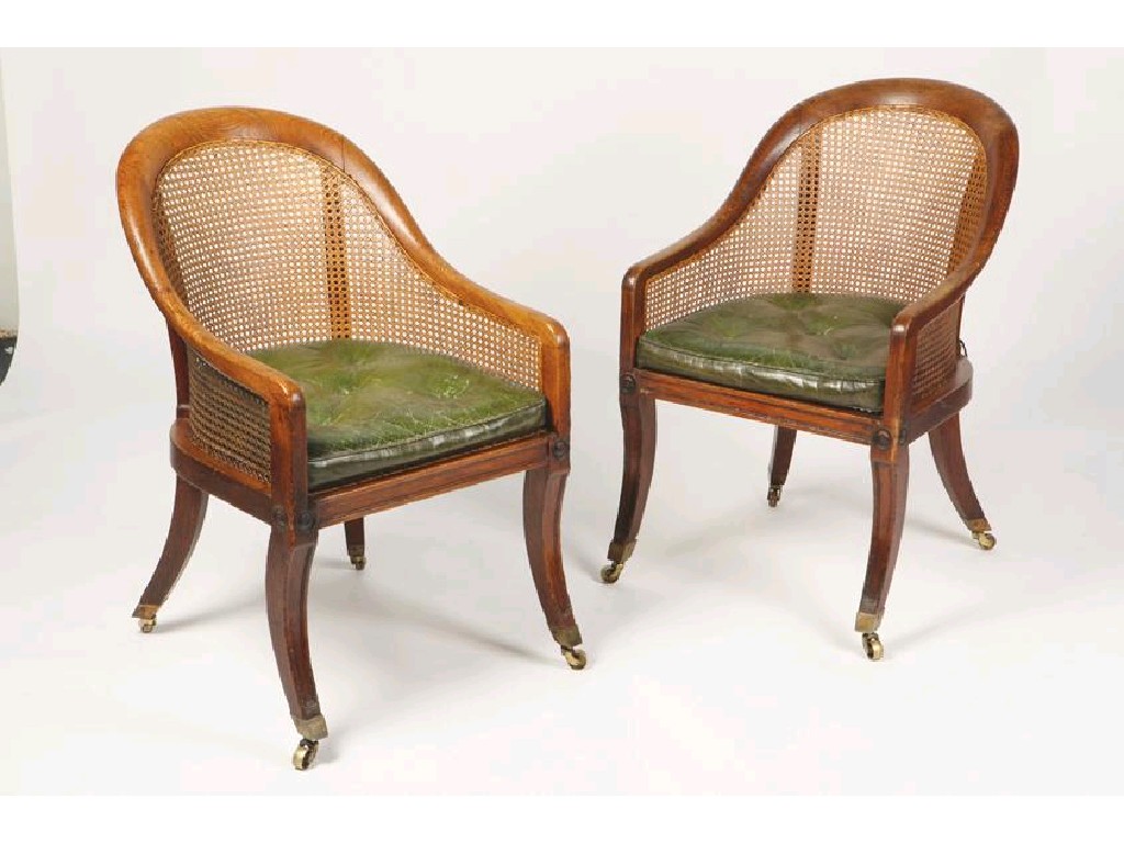 Appraisal: A PAIR OF REGENCY OAK CORACLE BERGERE CHAIRS with caned