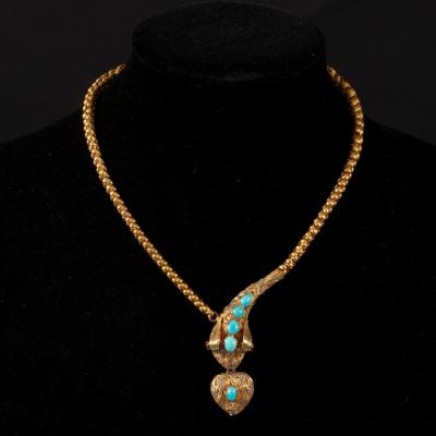 Appraisal: A Victorian snake necklace the head with cabochon turquoise accents