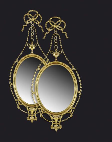 Appraisal: A pair of giltwood framed neo-classical wall mirrors In the