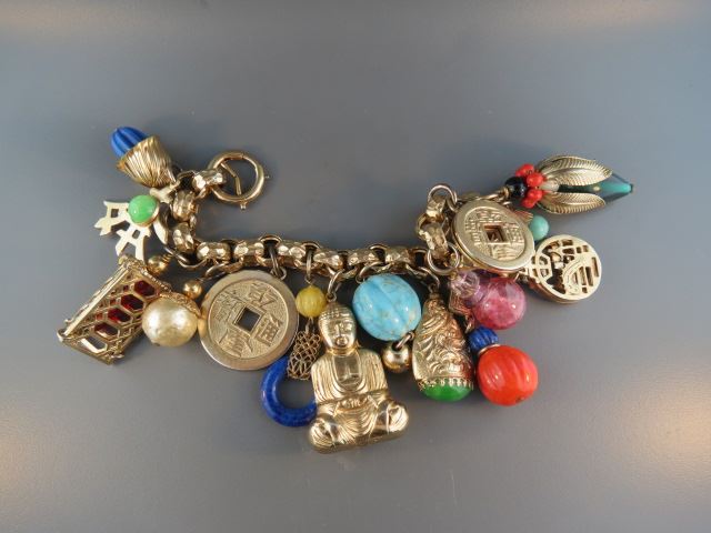 Appraisal: Napier Charm Bracelet large gold plated faux gems different signed