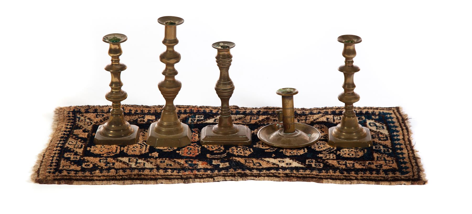 Appraisal: ORIENTAL MAT AND FIVE BRASS CANDLESTICKS First half- th century