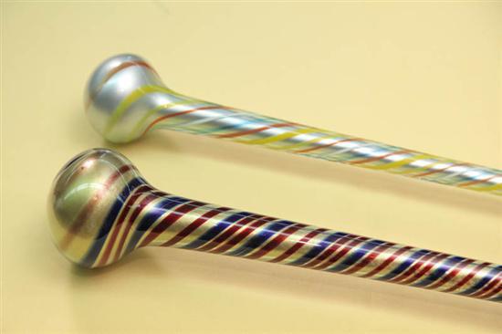 Appraisal: TWO GLASS CANES Gold with blue and maroon swirl decoration