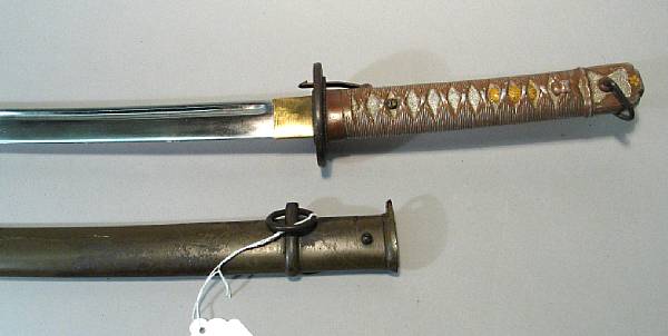 Appraisal: A Japanese shin-gunto NCO sword Slightly curved inch blade serial