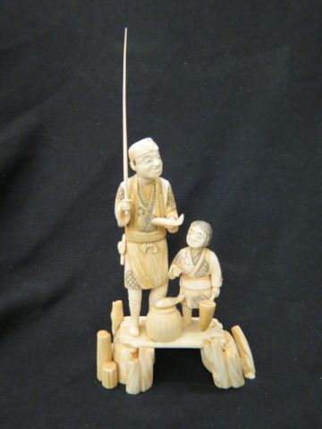 Appraisal: Japanese Carved Ivory Figurine of Fisherman holding a fish his