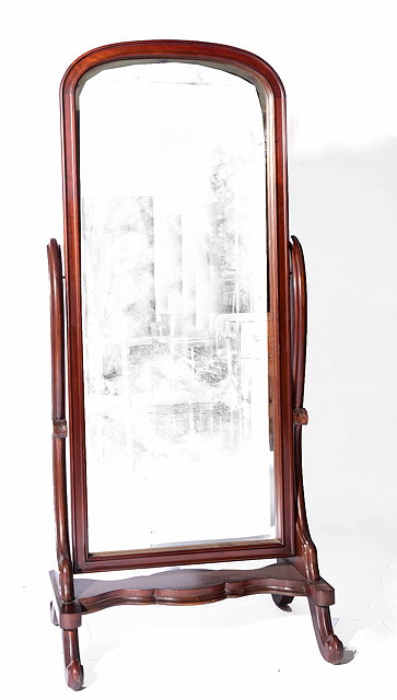 Appraisal: A th Century mahogany cheval mirrorwith scrolled supports and cabriole