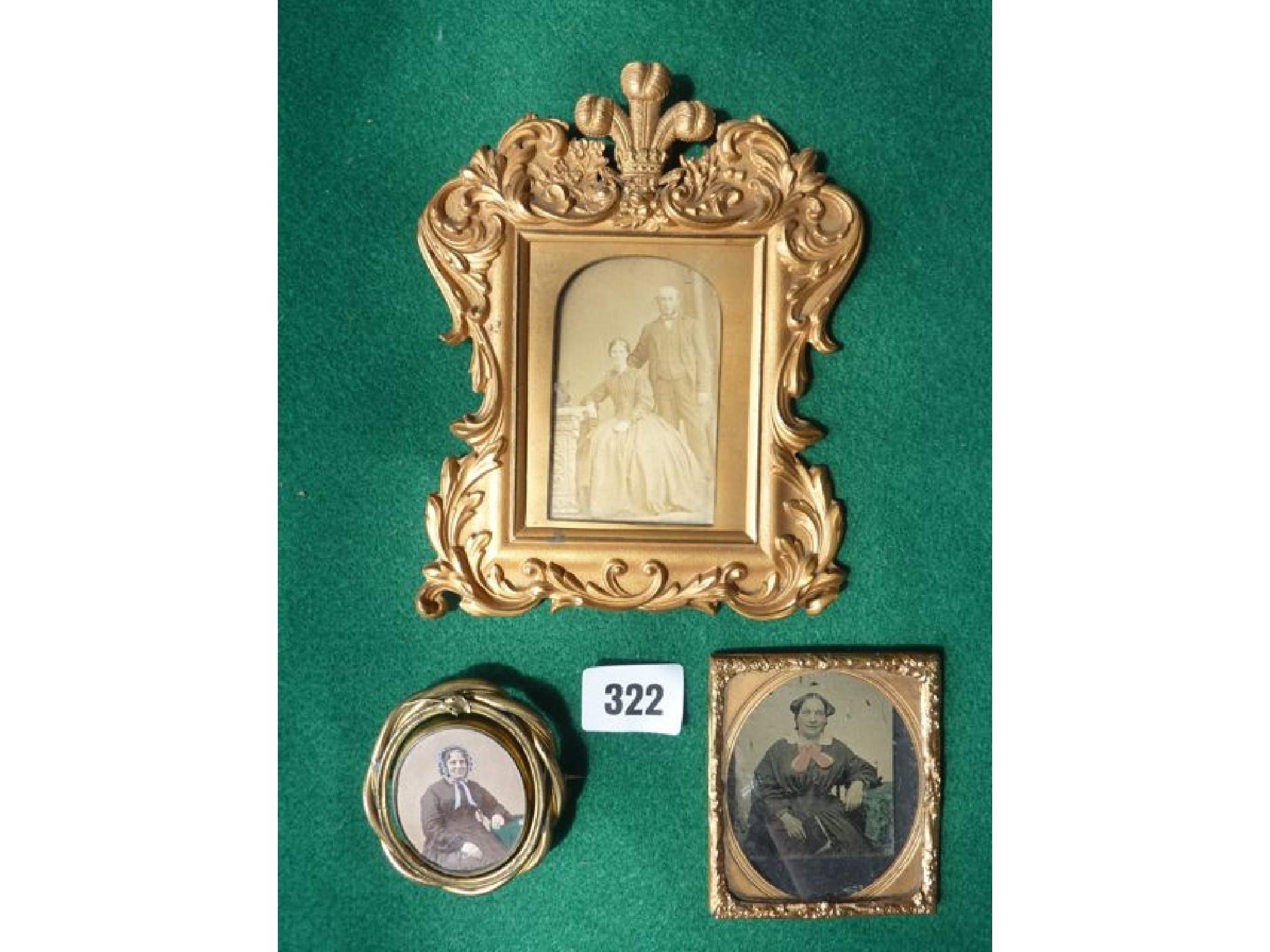 Appraisal: A Victorian embossed brass photographic portrait frame with scrolled and