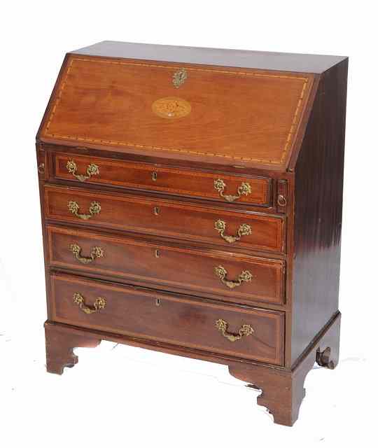 Appraisal: AN EDWARDIAN MAHOGANY BUREAU the interior fitted pigeon holes and