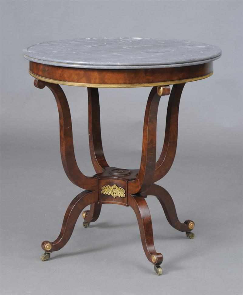 Appraisal: EMPIRE STYLE GILT-METAL MAHOGANY GU RIDON The circular gray Ste