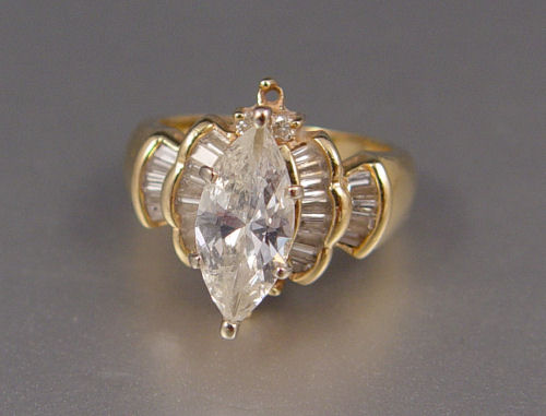 Appraisal: CT MARQUISE BRILLIANT DIAMOND RING K yellow gold ring centers