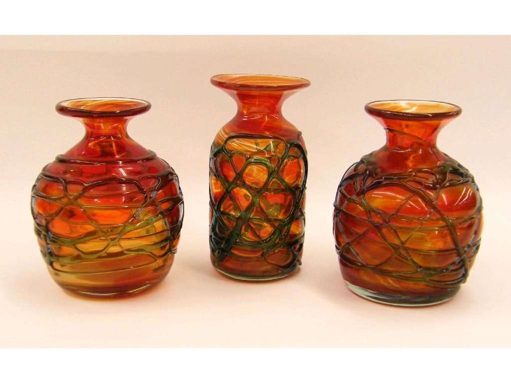 Appraisal: Three similar Mdina red glass vases each with trail decoration