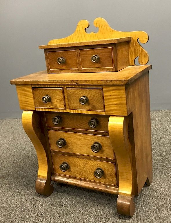 Appraisal: Miniature Empire Chest of Drawers Miniature Empire maple chest of