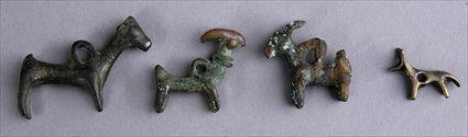 Appraisal: FOUR LURISTAN BRONZE ANIMAL-FORM AMULETS to in Provenance Property from