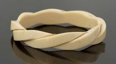 Appraisal: A Carved Ivory and Gold Wire Bangle Bracelet Carved ivory